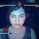 Ellie is seen with her eyes closed imagining playing a fighting game with health bars and button prompts on the screen.